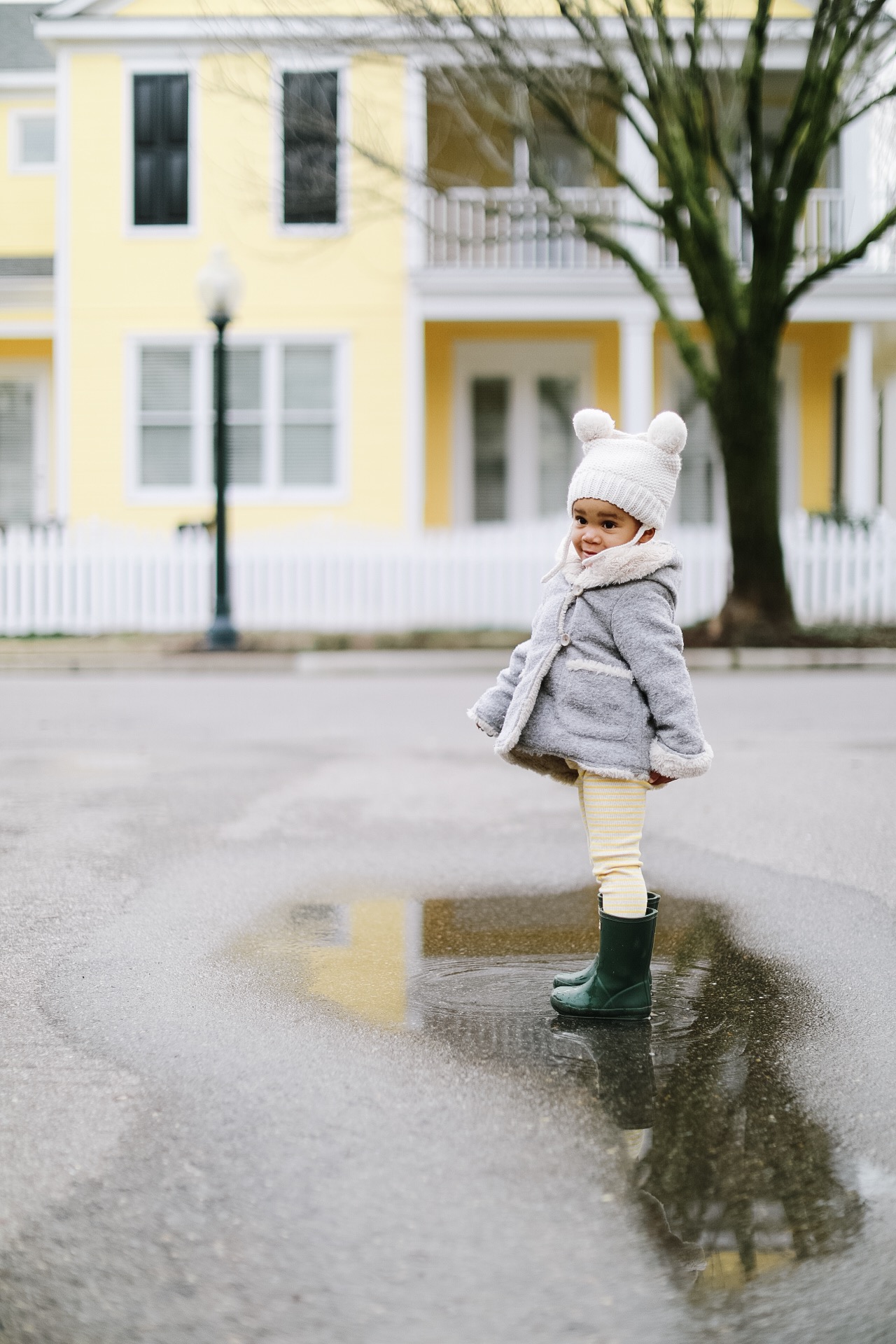 little girl in rainboots