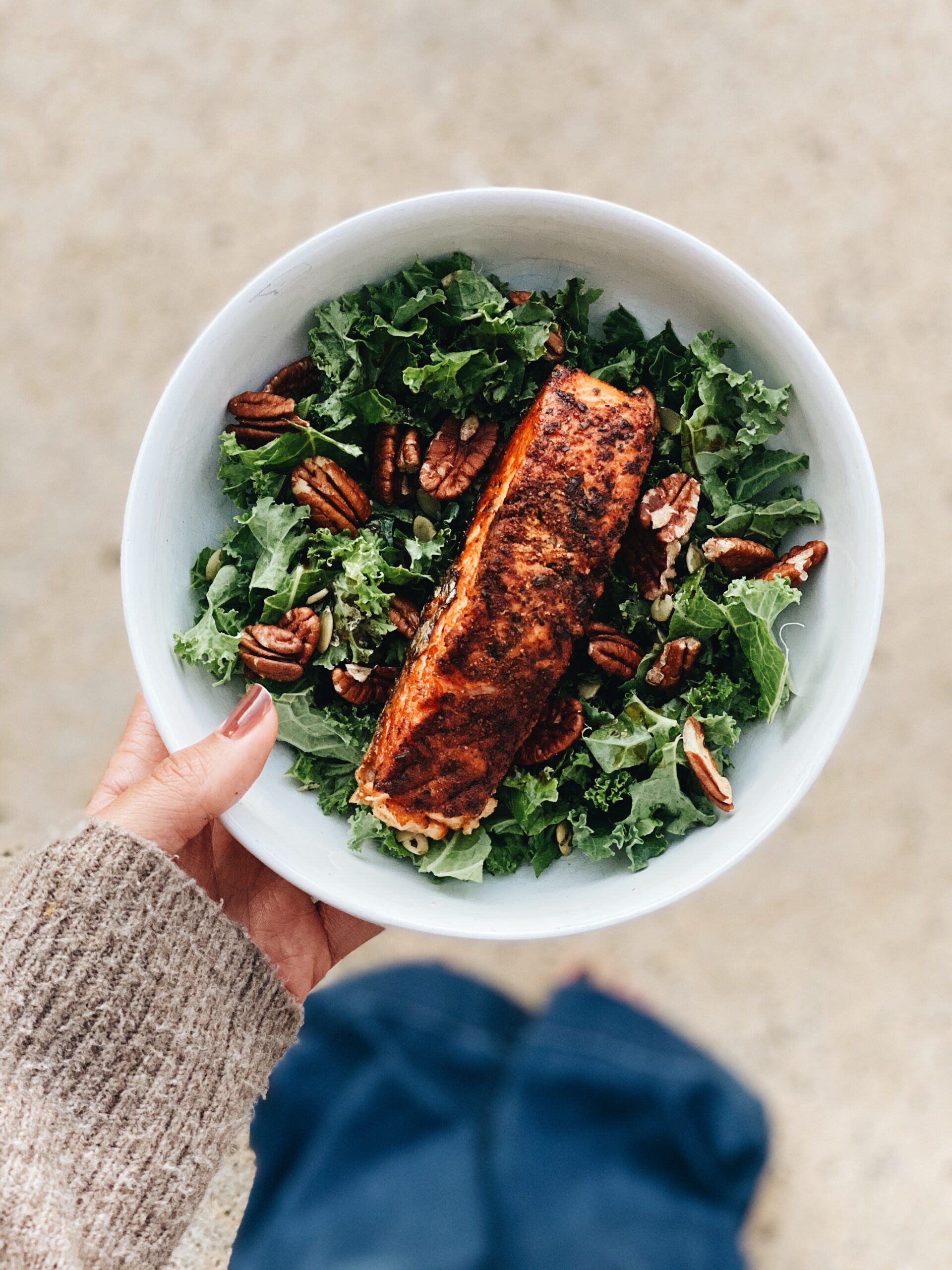 salmon over greens with pecans