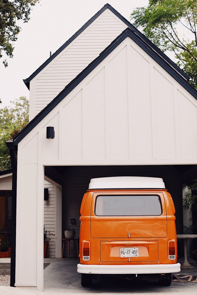 garage with bright orange bus
