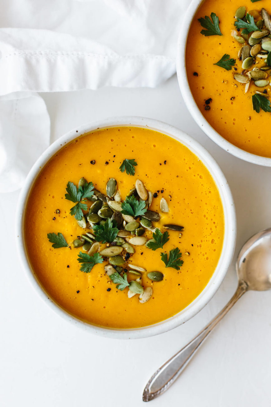 butternut squash soup with pumpkin seeds and cilantro topping